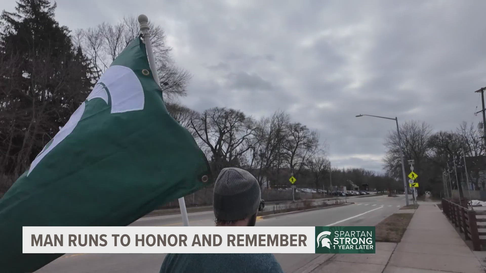 Zachary Baker usually runs with the U.S. flag to honor veterans, Tuesday he instead ran with the Spartan flag 1 year after the MSU shooting.